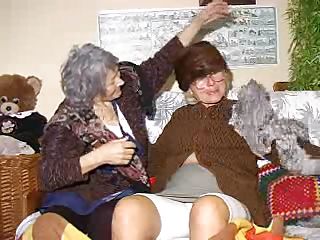 Two very old and saggy grannies and on their couch. These whores may be old but they are still lustful so without much talking the bitches take off their raiment and start some tits licking and pussy rubbing action. Look at the old..